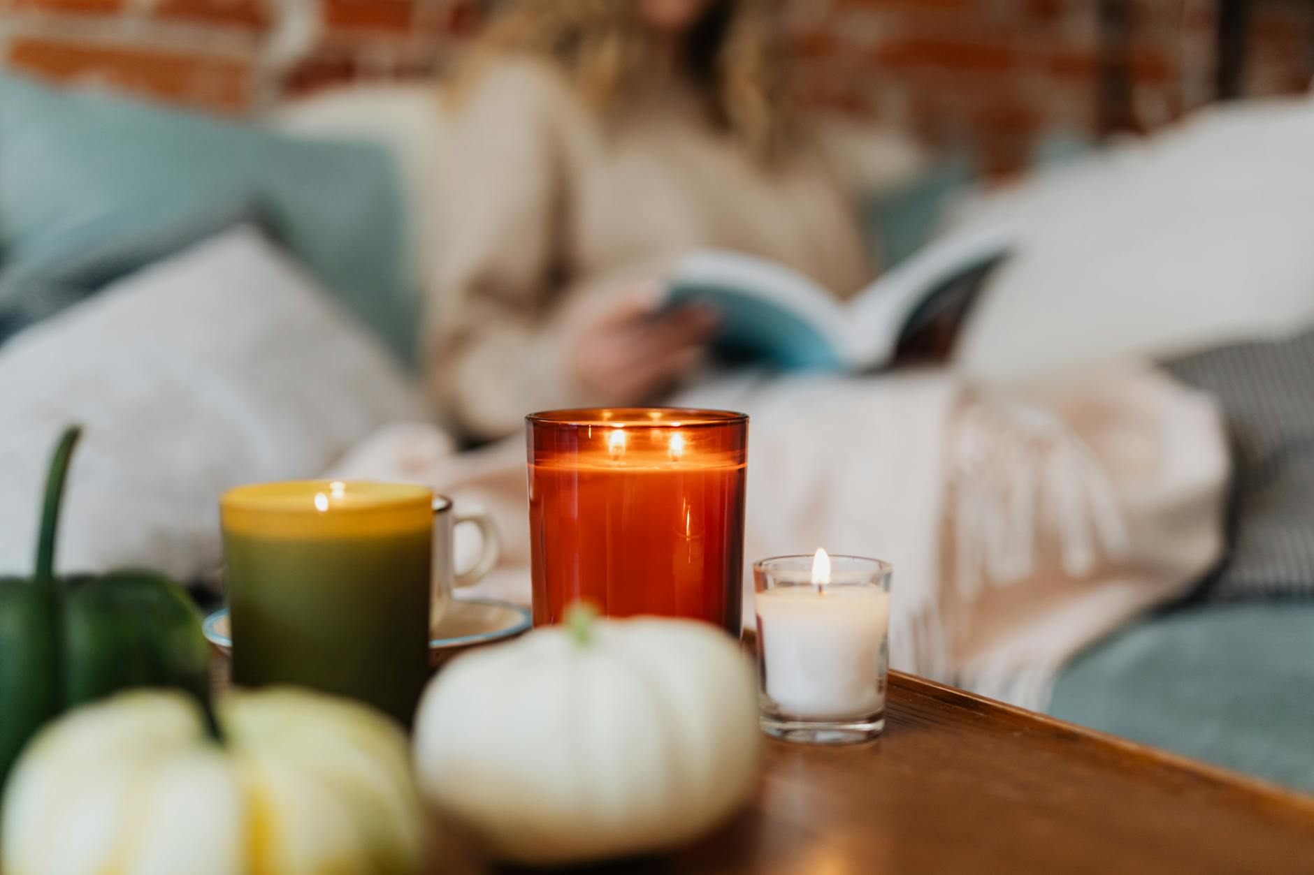 lighted candles on wooden table